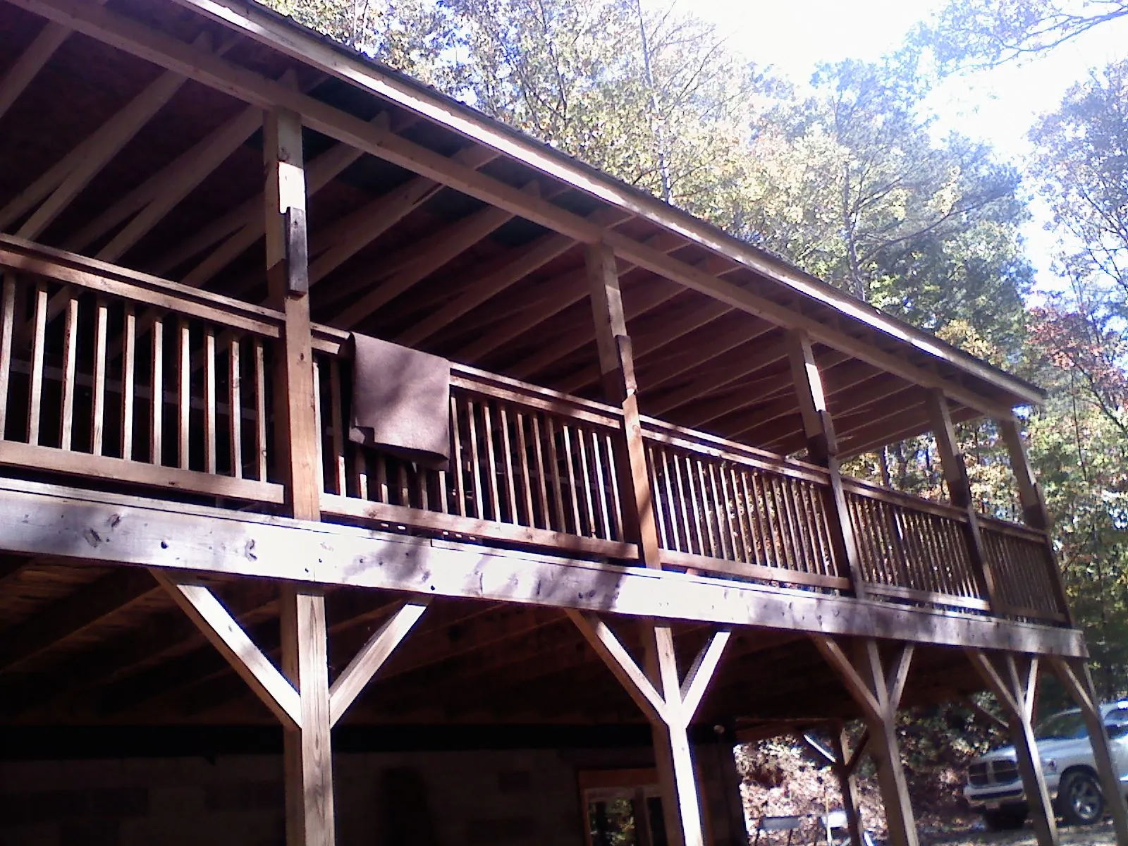 Timber framing under a new elevated porch and deck — Roof Leak Repair in Rougemont by Roofing Brothers